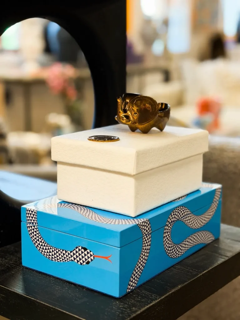 Blue and white decorative boxes with a gold accent
