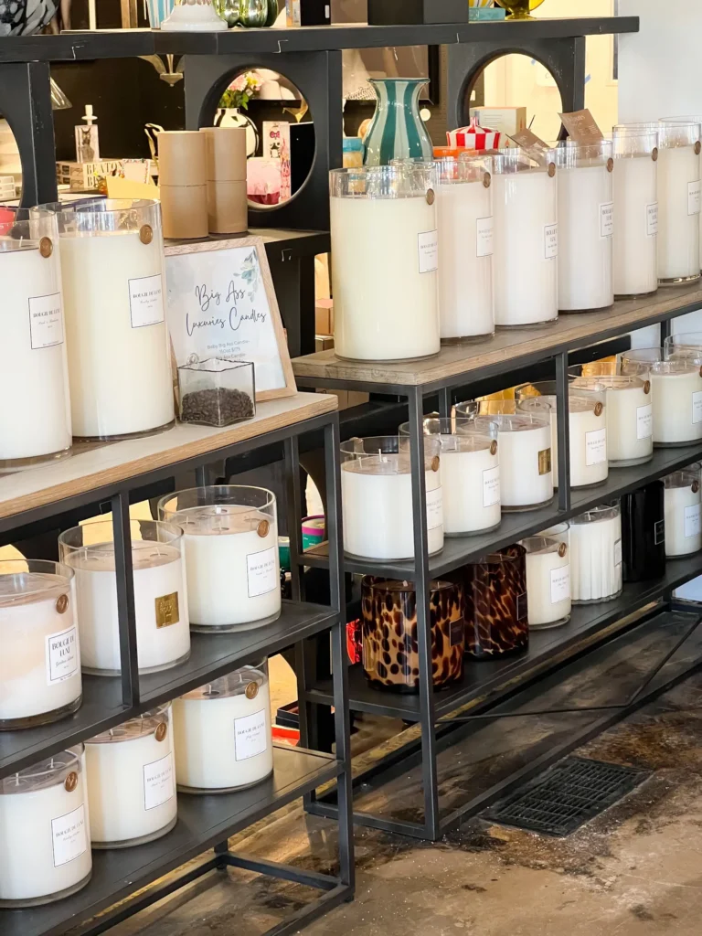 Shelves stocked with large candles at Live Boho