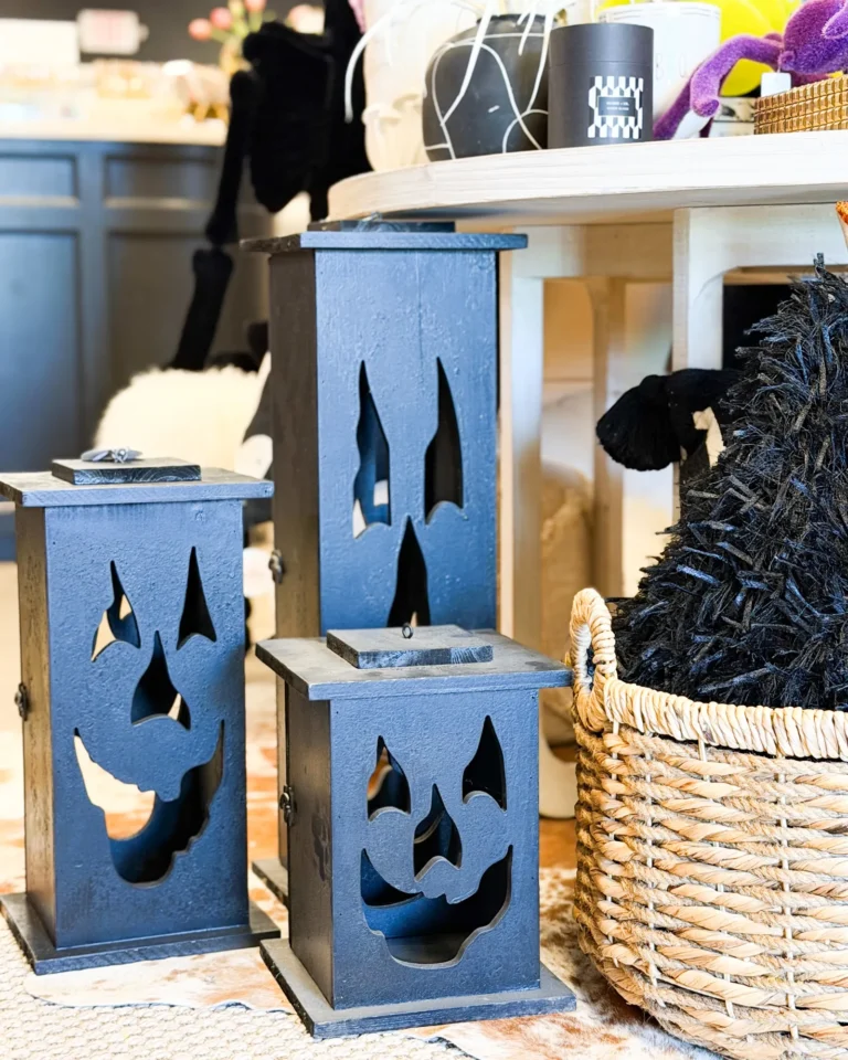 Navy lanterns with jack-o-lantern faces and a woven basket