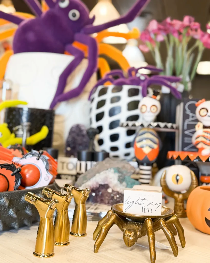 Playful purple spider and Halloween decor displayed on a table