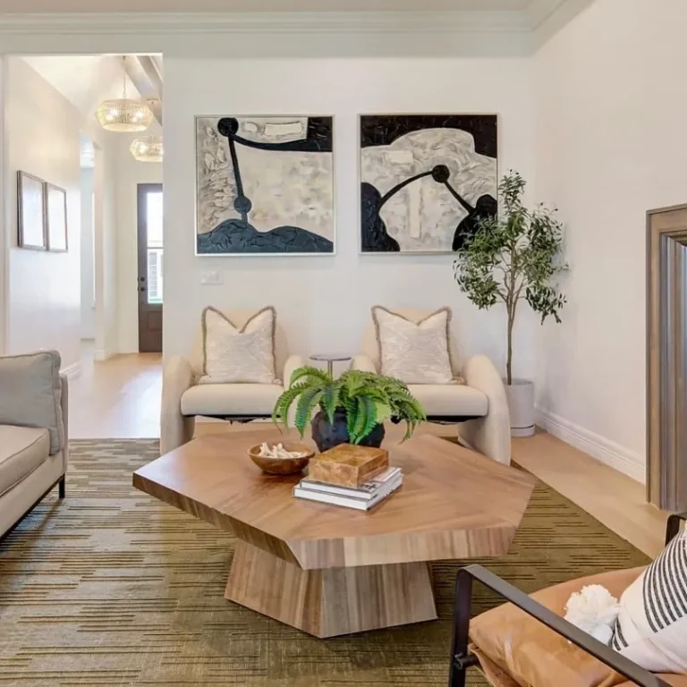 Bright staged living room with an olive tree, wood coffee table and abstract art – home staging Oklahoma City by Live Boho